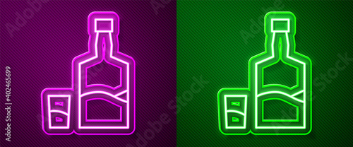 Glowing neon line Tequila bottle and shot glass icon isolated on purple and green background. Mexican alcohol drink. Vector.