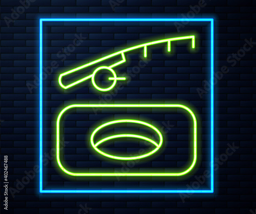 Glowing neon line Winter fishing icon isolated on brick wall background. Vector.