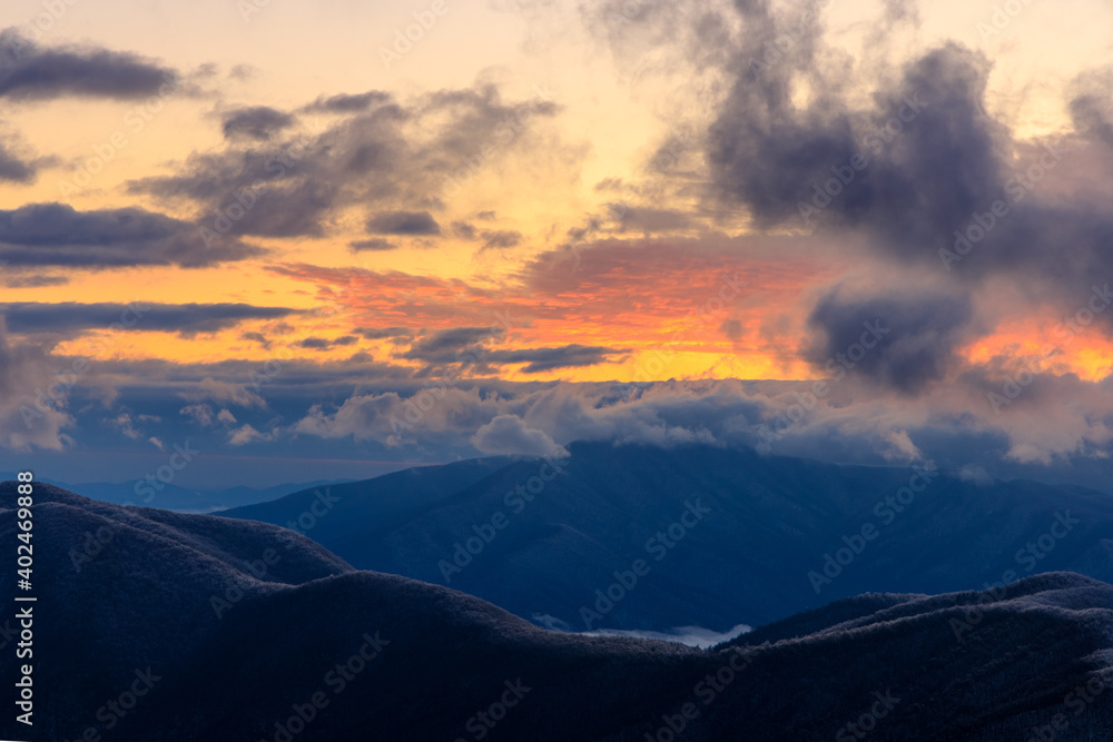 Devil's Knob Overlook – Blue Ridge Mountains horizon with pink and yellow clouds at sunset