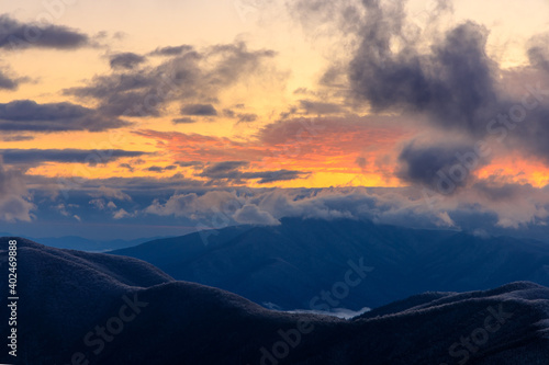 Devil s Knob Overlook     Blue Ridge Mountains horizon with pink and yellow clouds at sunset