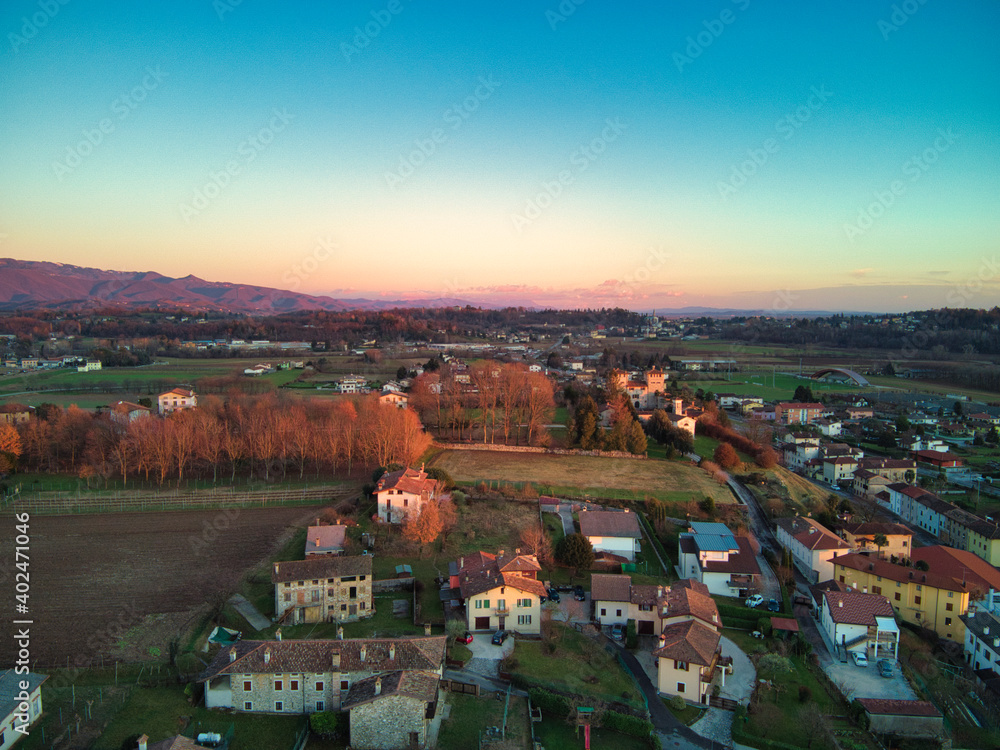 View from above between hills and snow-capped mountains