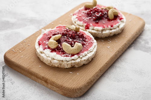 Rice Cakes with Cream Cheese and Raspberry Jam with Cashew Nuts
