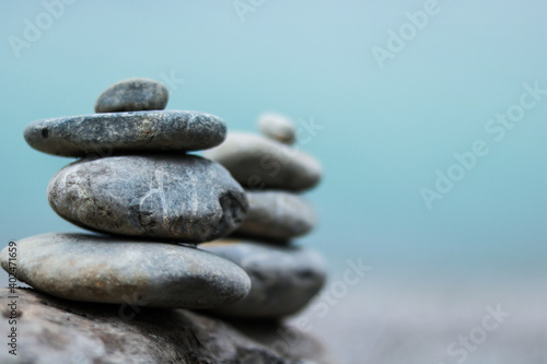 Balance stone on lake coast. Symbol of relax