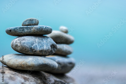 Balance stone on blue background. symbol of relax