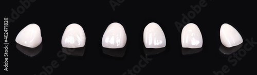 Obraz na plátně Ceramic dentures and crowns on black background