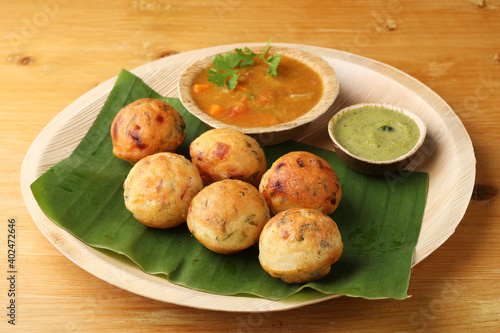 Kuzhi Paniyaram served with coconut chutney and sambar- South Indian breakfast