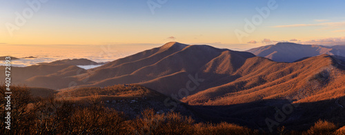 Devil's Knob Overlook– Panorama of Blue Ridge Mountains and low lying clouds shortly after sunrise in winter © Mark Eichenberger