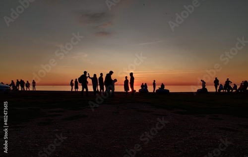 Sunset with people in silhouette at Visby, Gotland, Sweden.
