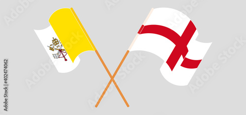 Crossed and waving flags of Vatican and England