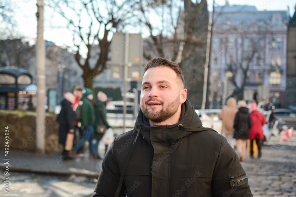 Attractive guy portrait in winter on the street Attractive guy portrait in winter on the street