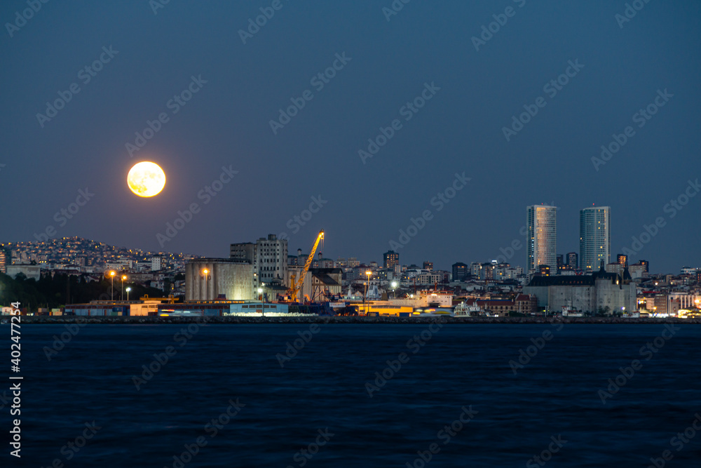 full moon rising over Istanbul city