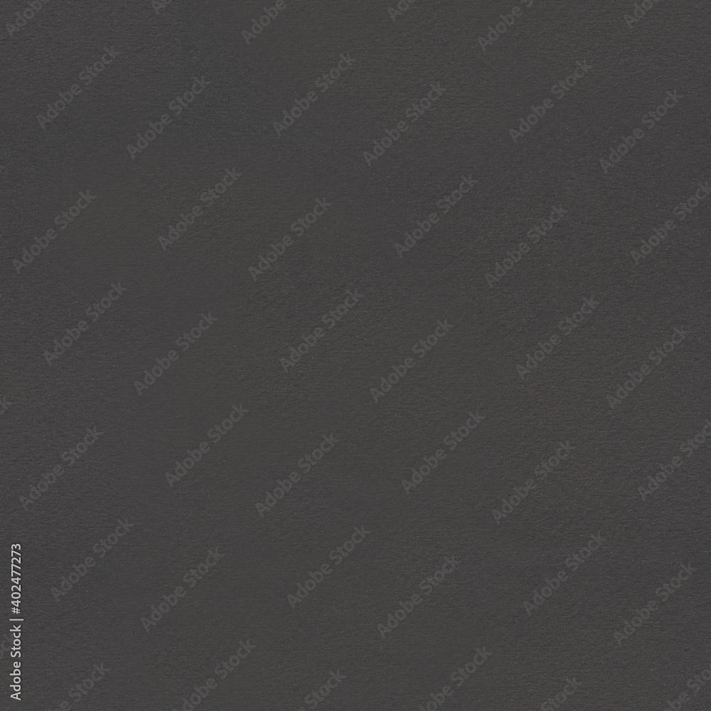 Seamless Black cardboard background with closeup on a piece of black colored paper. Seamless Black cardboard background with closeup on a piece of black colored paper.