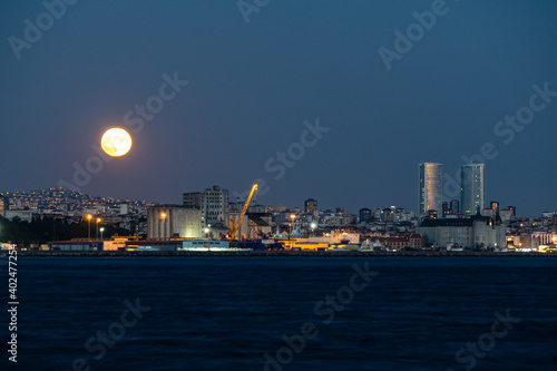 full moon rising over Istanbul city
