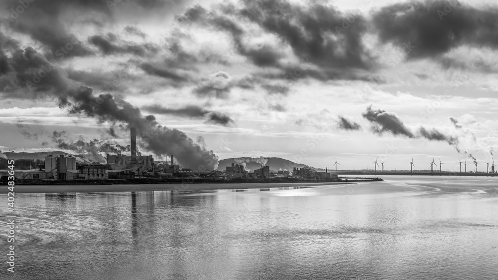 Steam from the banks of the Manchester Ship Canal in monochrome