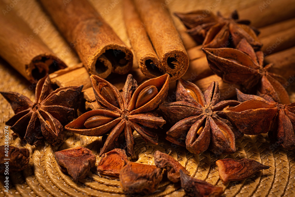 Star Anise with Cinnamon Sticks on Woven Mat Star Anise with Cinnamon Sticks on Woven Mat