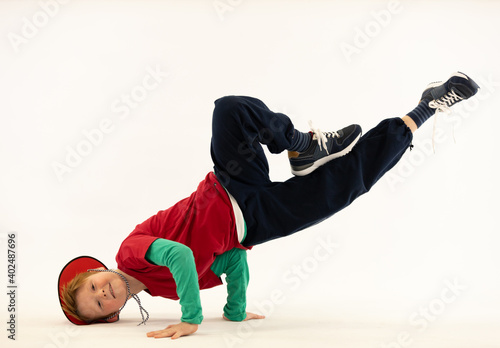 boy in difficult breakdance position, special boy, crazy kid, super kid, hip hop dancer, boy in acrobatic position