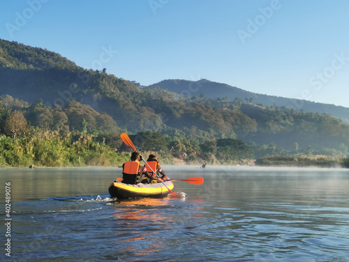 Women and men kayaking in the morning