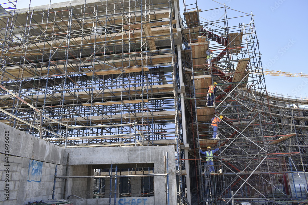 scaffolding in construction works. a new civil construction site Building in Oman. Oman city. Muscat, Oman 