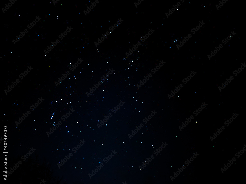A night sky with star clusters (The Pleiades, Orion belt cluster)