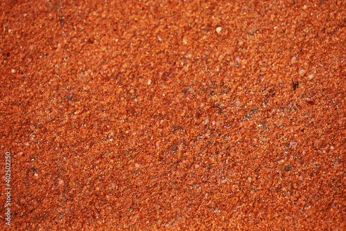 red orange and light copper color of ancient laterite wall photo