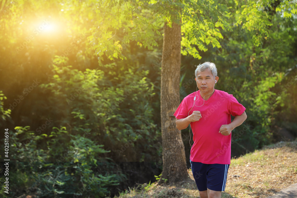 Older men exercise by running on the street in the morning. Older men exercise by running on the street in the morning.