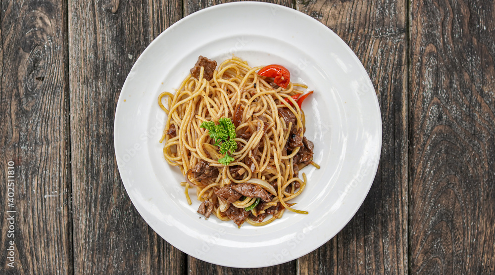 spaghetti with white plate on top table spaghetti with white plate on top table