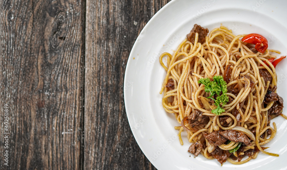 spaghetti with white plate on top table spaghetti with white plate on top table