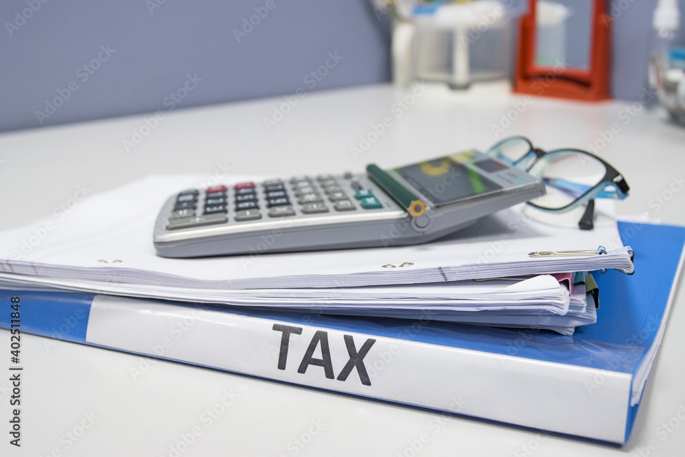 Folder Tax documents and paper files concept Annual tax payment Folder Tax documents and paper files concept Annual tax payment