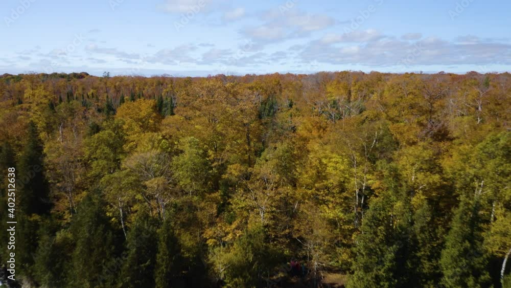 Drone Flies Away from Autumn Forest, Reveals Choppy Waters Crashing on Coastline. Door County, Wisconsin. Autumn Landscape Drone Flies Away from Autumn Forest, Reveals Choppy Waters Crashing on Coastline. Door County, Wisconsin. Autumn Landscape