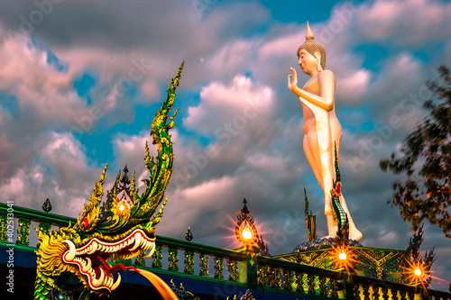 Background of Thailand's Chonburi religious attractions (Wat Khao Phra Khru viewpoint), with beautiful Buddha and Phaya Naga statues, tourists always come to make merit and take pictures at night. photo