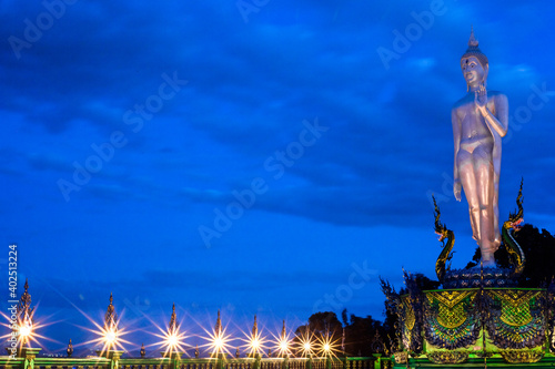 Background of Thailand's Chonburi religious attractions (Wat Khao Phra Khru viewpoint), with beautiful Buddha and Phaya Naga statues, tourists always come to make merit and take pictures at night. photo