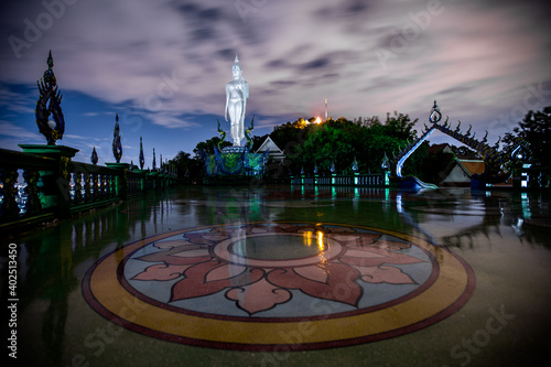 Background of Thailand's Chonburi religious attractions (Wat Khao Phra Khru viewpoint), with beautiful Buddha and Phaya Naga statues, tourists always come to make merit and take pictures at night. photo