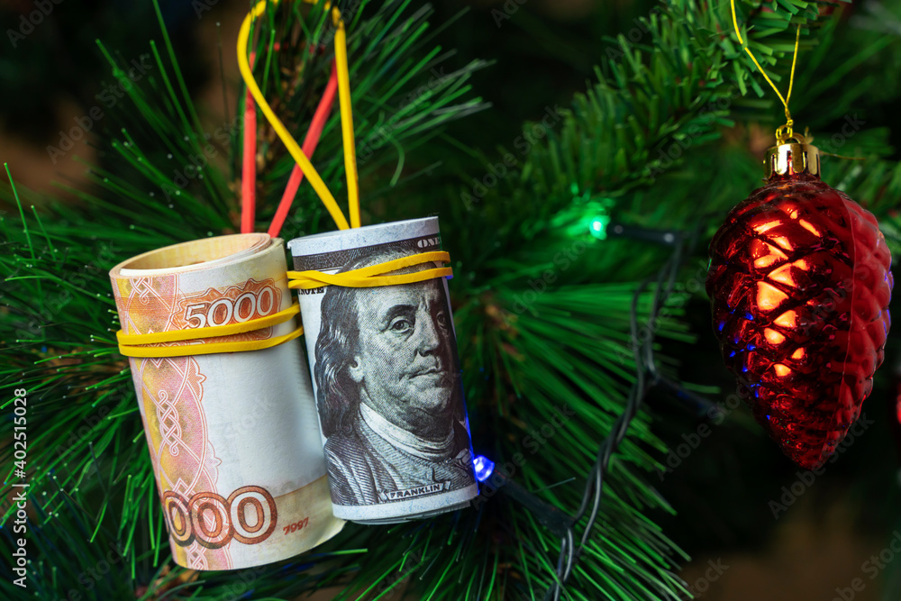 money on the Christmas tree in the form of a Christmas tree toy money on the Christmas tree in the form of a Christmas tree toy