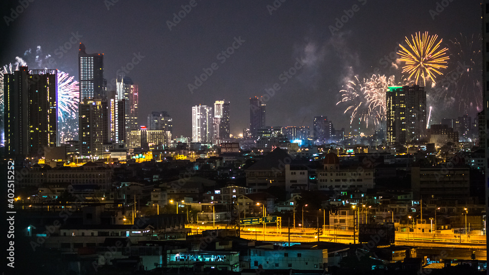 The high angle background of the city view with the secret light of the evening, blurring of night lights, showing the distribution of condominiums, dense homes in the capital community The high angle background of the city view with the secret light of the evening, blurring of night lights, showing the distribution of condominiums, dense homes in the capital community