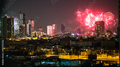 The high angle background of the city view with the secret light of the evening, blurring of night lights, showing the distribution of condominiums, dense homes in the capital community