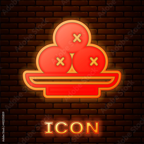 Glowing neon Olives on plate icon isolated on brick wall background. Vector.
