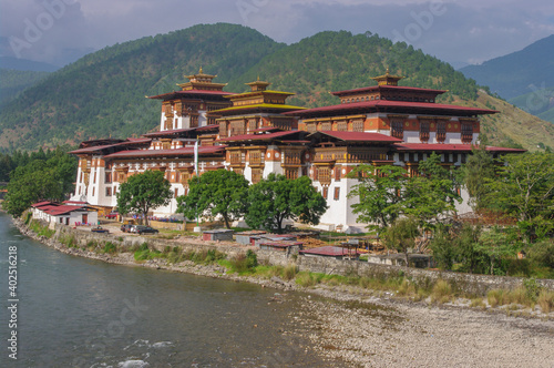 Scenic landscape view of ancient historic landmark Punakha dzong on bank of Mo Chhu river, Western Bhutan 