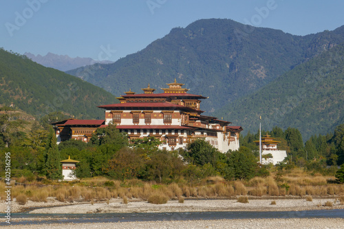 Side view of Punakha dzong in Western Bhutan with Mo Chhu river in foreground 
