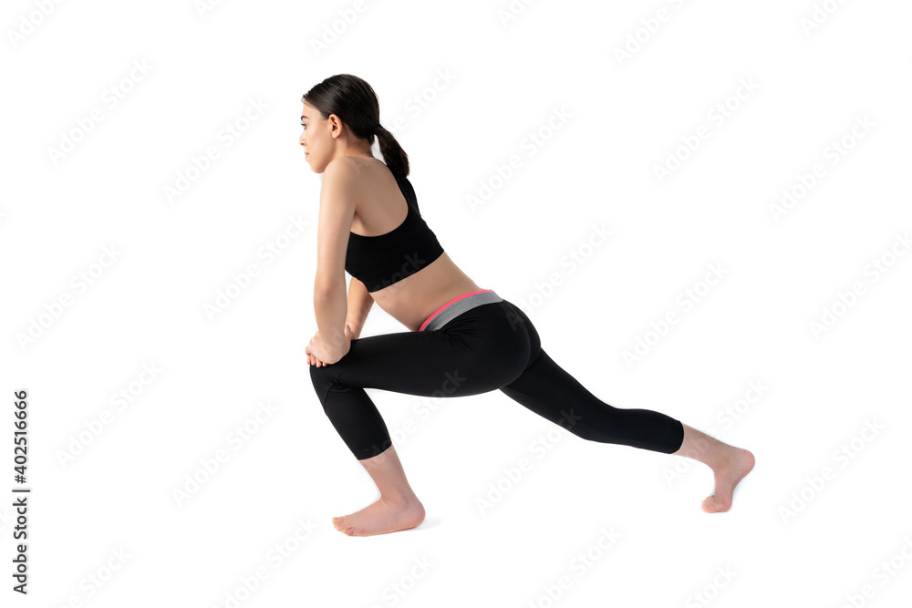 Young woman doing yoga practice isolated on white background. Flexible fit female body. Horizontal shot. High resolution sharp photo. Young woman doing yoga practice isolated on white background. Flexible fit female body. Horizontal shot. High resolution sharp photo.