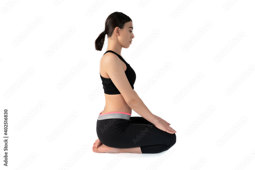 Young woman doing yoga practice isolated on white background. Flexible fit female body. Horizontal shot. High resolution sharp photo. Young woman doing yoga practice isolated on white background. Flexible fit female body. Horizontal shot. High resolution sharp photo.
