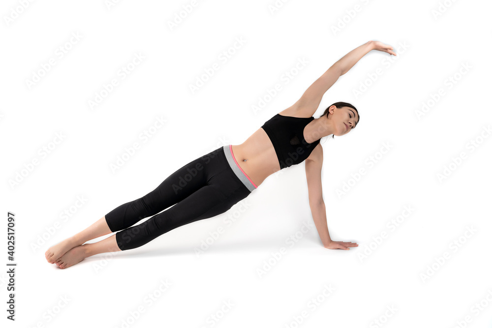 Young woman doing yoga practice isolated on white background. Flexible fit female body. Horizontal shot. High resolution sharp photo.