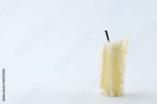 Photo of a melted candle that can be used as a background for a theme concept about feelings photo