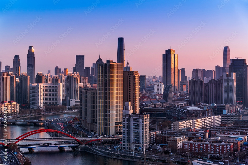 Sunset waterfront downtown skyline with Tianjin high-rise building cityscape at Haihe riverside, , Tianjin city, China