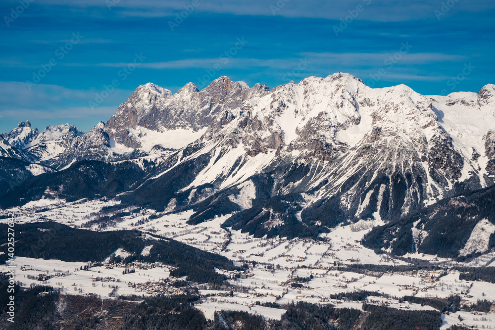 Fototapeta premium Scheichenspitze Mountain Peak in the Dachstein Mountain Range and the Village of Ramsau am Dachstein from Above in Winter