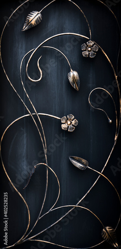 Beautiful forged leaves on a metal gate