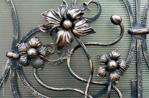 Metal gates with decorative elements. Forged Products