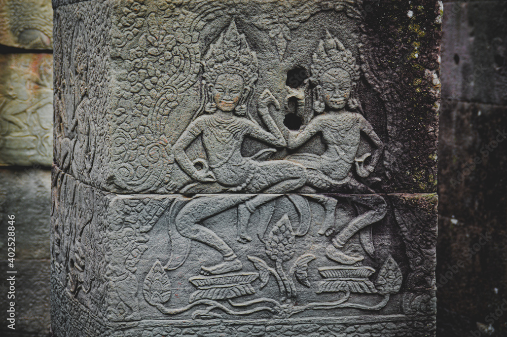 Bas-relief decoration depicting the Apsara Dancers in the walls of Angkor Wat in Cambodia