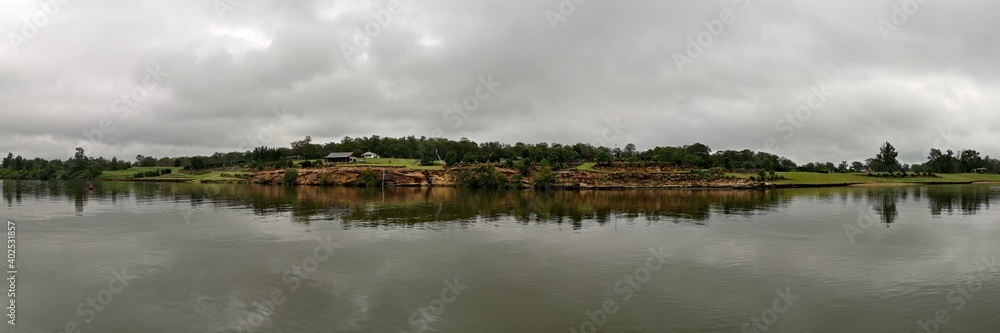 Beautiful panoramic view of river with reflections of small hills, trees and clouds on water, Hawkesbury river, Cattai national Park, New South Wales, Australia
Beautiful panoramic view of river with reflections of small hills, trees and clouds on water, Hawkesbury river, Cattai national Park, New South Wales, Australia