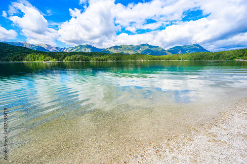 Paradise beach at Eibsee lake. Beautiful landscape scenery with clear blue water in German Alps at Zugspitze mountain - Garmisch Partenkirchen, Grainau - Bavaria, Germany, Europe.