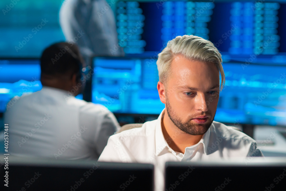 Team of brokers is working in office using workstation and analysis technology. Workplace of professional traders. Global financial markets, business, currency exchange and banking concepts. Team of brokers is working in office using workstation and analysis technology. Workplace of professional traders. Global financial markets, business, currency exchange and banking concepts.